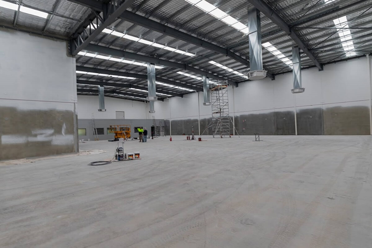Large industrial space being painted by Perth industrial painters, AJ Cochrane