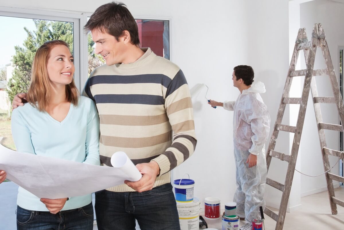Young couple overseeing home renovations - Perth suburbs to watch for flippable properties